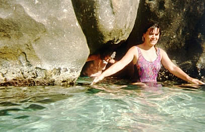 Anne standing against wall in rising water