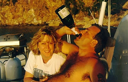 Jim chugging a bottle of champagne