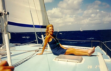 Janet sunbathing while sailing