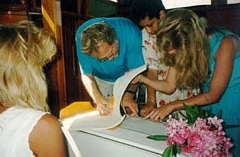 Ken and Darla sign the register