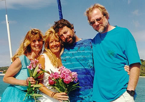 The bride and groom with the best man and maid of honor