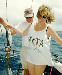 Cheryl catches the first fish, a tuna