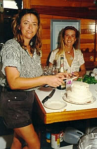Mary and Lisa decorating the cake