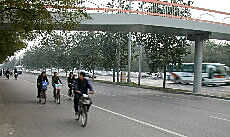 Bicyclists, highway and walkway, Beijing