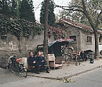 Residents waving in the Hutong, Beijing