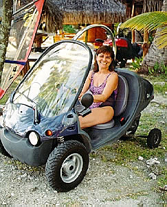Anne sitting in a small scooter